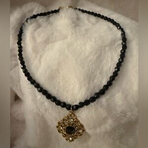 Vintage 1928 Marked Black Bead Necklace with Golden Pendant